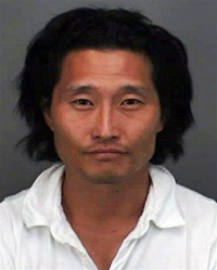 October 25, 2007 photo released by the Honolulu Police Department, actor Daniel Dae Kim is shown after his arrest in Honolulu, Hawaii.